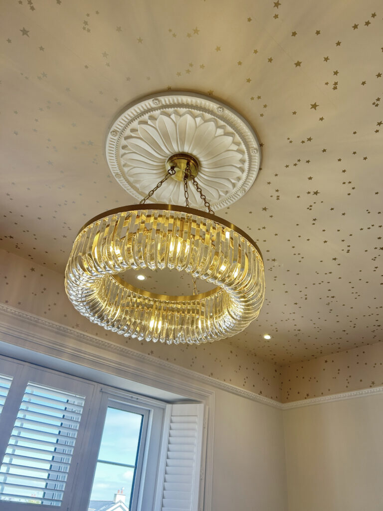 Wallpapered ceiling with chandelier